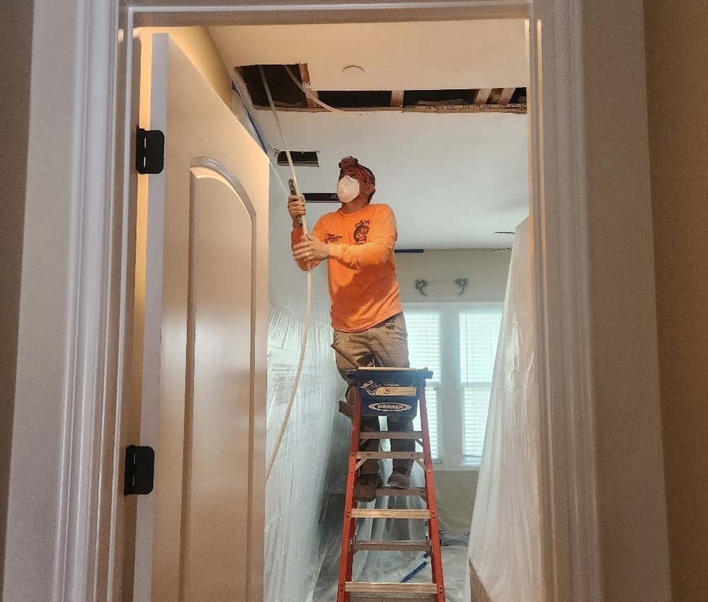 G & W repipe team working inside a home